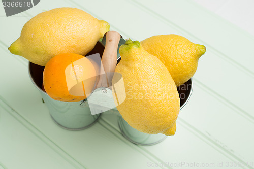 Image of Limes on wooden table