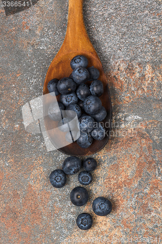 Image of Blueberries on a wooden spoon