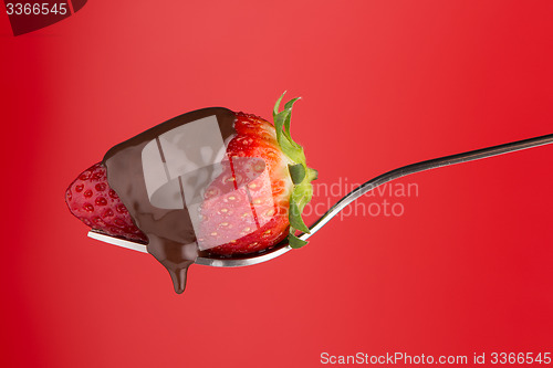 Image of Strawberry and chocolate on a fork