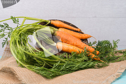 Image of Carrots on a wooden table