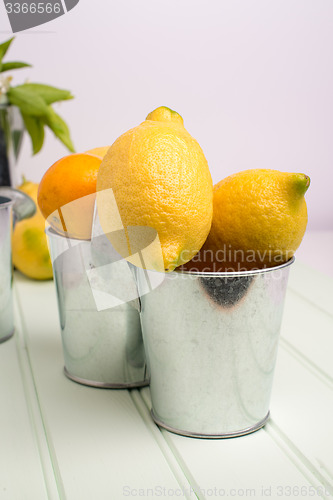 Image of Limes on wooden table