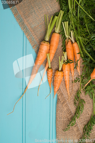 Image of Carrots on a wooden table