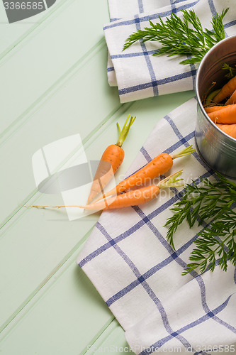 Image of Carrots on wooden table