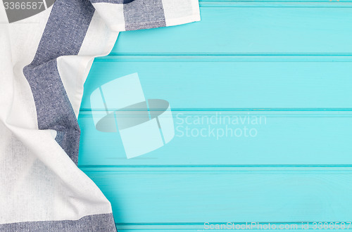 Image of Blue and white towel over table