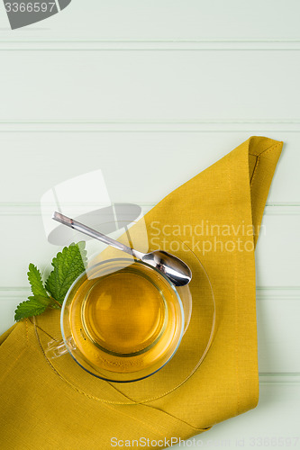 Image of Herbal tea with melissa in a glass cup