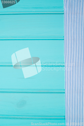 Image of Blue and white towel over table