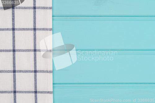 Image of Blue and white towel over table