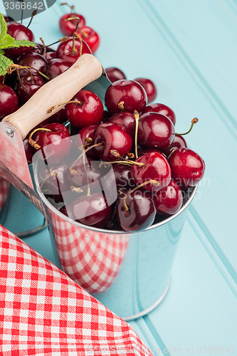 Image of Cherries in two small metal buckets
