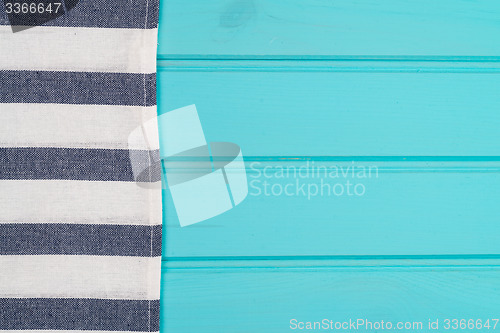 Image of Blue and white towel over table