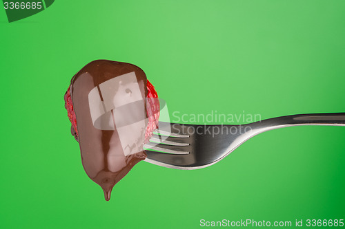 Image of Strawberry and chocolate on a fork