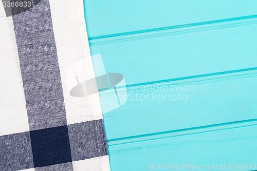 Image of Blue and white towel over table