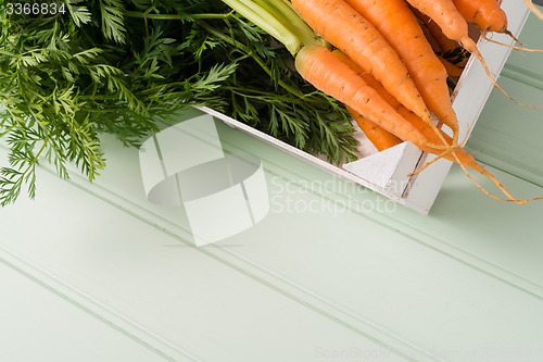 Image of Carrots on wooden table