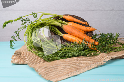 Image of Carrots on a wooden table