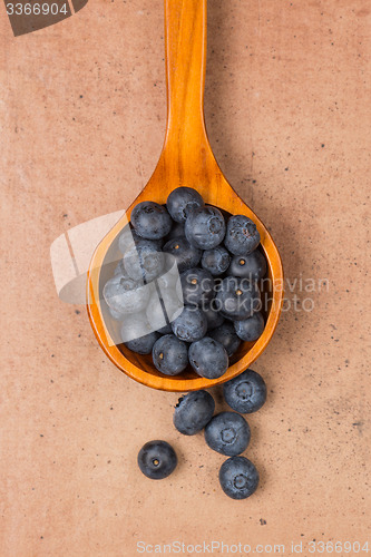 Image of Blueberries on a wooden spoon