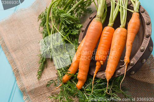 Image of Carrots on a wooden table