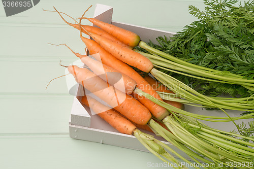 Image of Carrots on wooden table