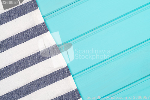 Image of Blue and white towel over table