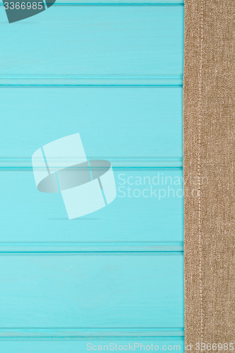 Image of Beige and white towel over table