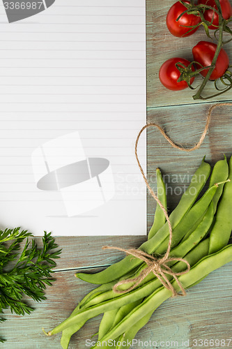 Image of White paper and vegetables