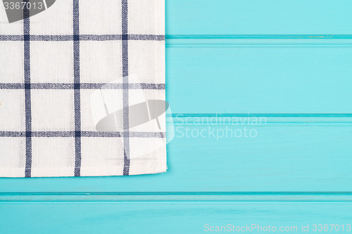 Image of Blue and white towel over table