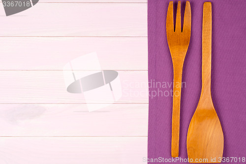 Image of Kitchenware on purple towel