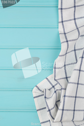 Image of Blue and white towel over table