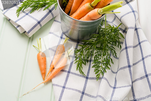 Image of Carrots on wooden table