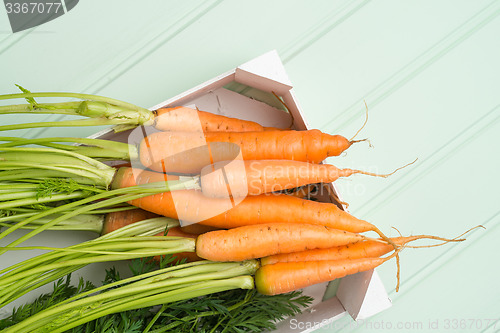 Image of Carrots on wooden table