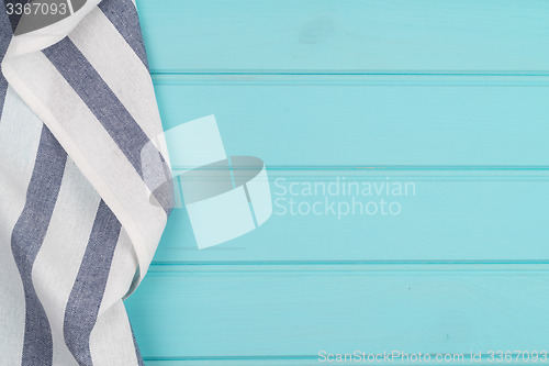 Image of Blue and white towel over table