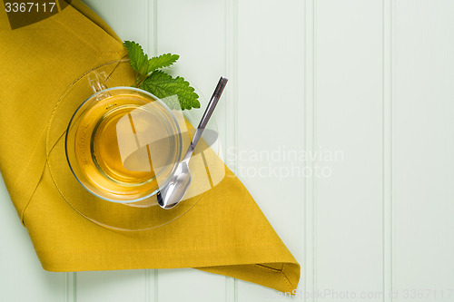 Image of Herbal tea with melissa in a glass cup