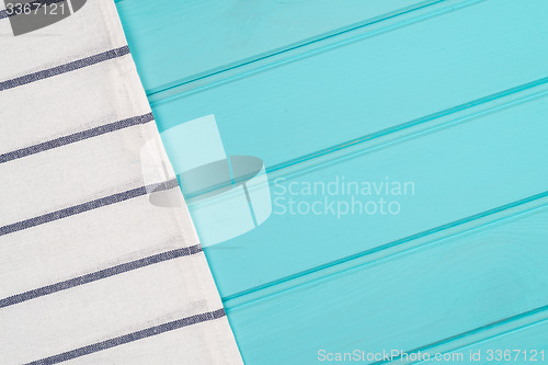 Image of Blue and white towel over table