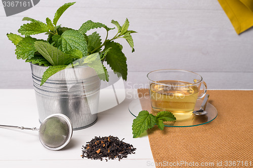 Image of Herbal tea with melissa in a glass cup