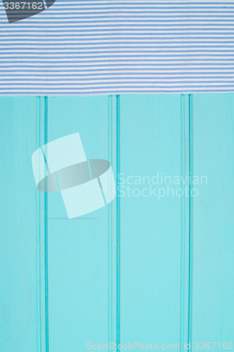 Image of Blue and white towel over table