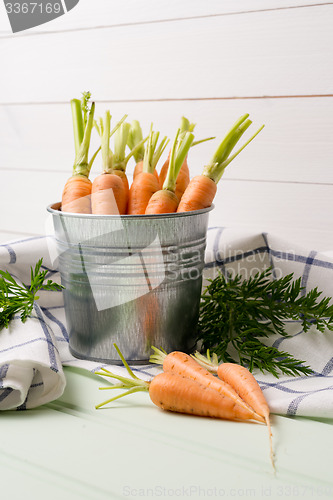 Image of Carrots on wooden table
