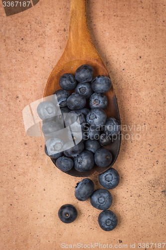 Image of Blueberries on a wooden spoon