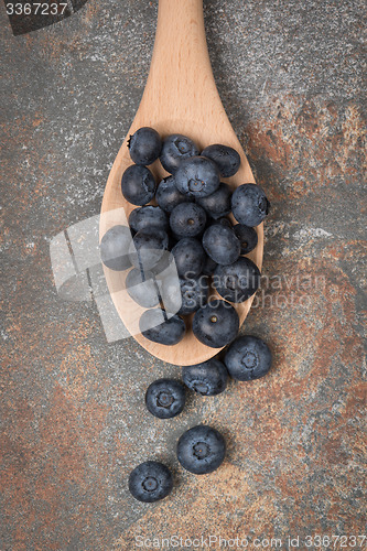 Image of Blueberries on a wooden spoon