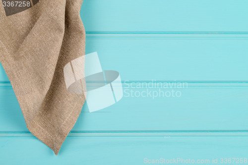 Image of Beige and white towel over table