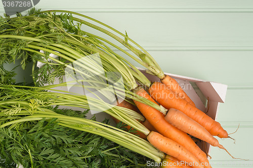 Image of Carrots on wooden table