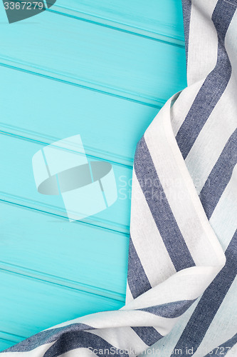 Image of Blue and white towel over table