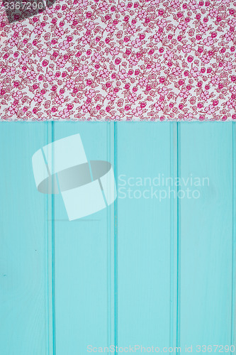 Image of Pink towel over wooden table