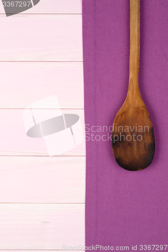 Image of Kitchenware on purple towel