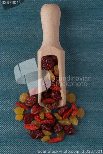 Image of Wooden scoop with mixed dried fruits