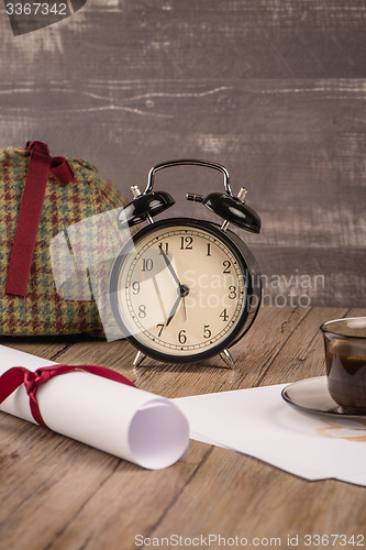 Image of Wrapped paper sheets and magnifying glass