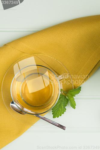 Image of Herbal tea with melissa in a glass cup