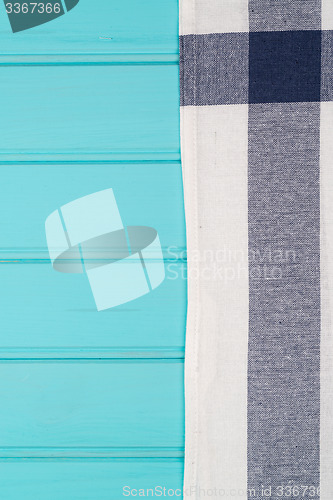 Image of Blue and white towel over table