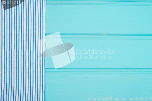 Image of Blue and white towel over table