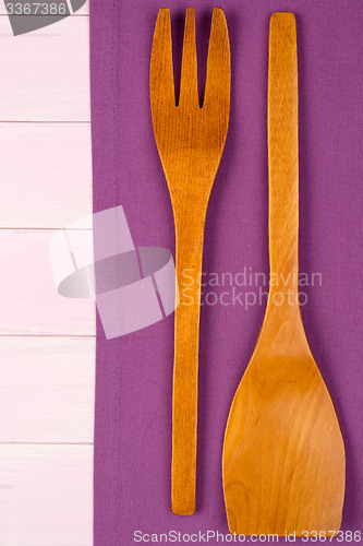 Image of Kitchenware on purple towel