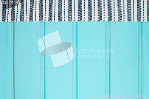 Image of Blue and white towel over table