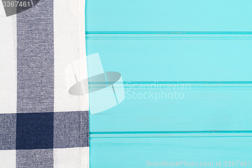 Image of Blue and white towel over table