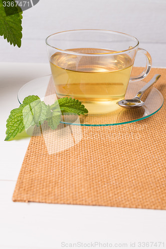 Image of Herbal tea with melissa in a glass cup